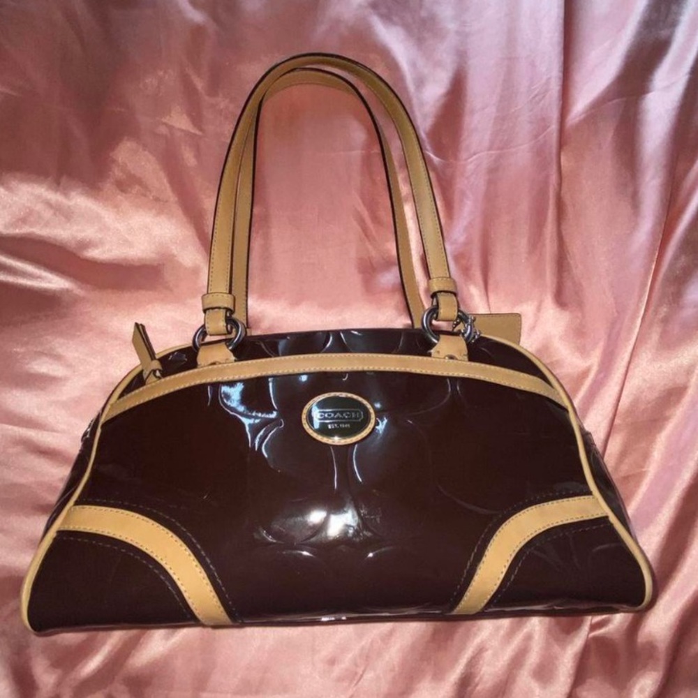 brown patent leather coach logo handbag with pink lining